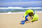 stock photo of beach  - Toy bucket and shovel on a tropical island beach
 - JPG 