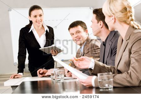 Picture or Photo of Portrait of business people discussing a new strategy at a seminar