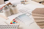 picture of interior  - Office of interior designer with paint and color swatch on the desk - JPG 