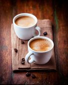 stock photo of cup  - Two cups of espresso on brown napkin - JPG 