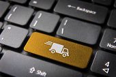 stock photo of keyboard  - Transport delivery key with truck icon on laptop keyboard - JPG 