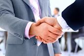 picture of handshake  - handshake isolated on business background - JPG 