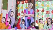 picture of preschool  - happy child kids group have fun and play at kindergarden indoor preschool education concept with  teacher - JPG 