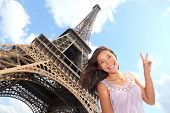 picture of france  - Eiffel Tower tourist posing smiling by Eiffel Tower Paris France during Europe travel trip. Young happy excited multiracial Asian Caucasian woman in her 20s.
** Note: Slight graininess, best at smaller sizes - JPG 