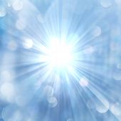 picture of beams  - Brilliance of sun beams sparkle from center on twinkling blue luminous abstract background - JPG 