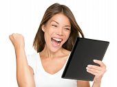 stock photo of woman  - Tablet computer woman winning happy excited looking at screen isolated on white background - JPG 