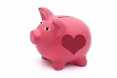 picture of future  - A pink piggy bank with heart shape on it isolated on white Love saving for your future - JPG 
