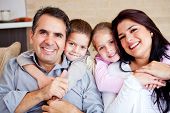 foto of home  - Portrait of a happy family smiling at home - JPG 