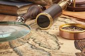 image of map  - Vintage brass telescope on antique map - JPG 