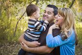 pic of ethnic  - Happy Mixed Race Ethnic Family Having Fun Playing In The Park - JPG 