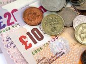 picture of currency  - Detail of British Pounds banknotes and coins - JPG 