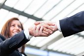 picture of handshake  - Businesspeople shaking hands at the office - JPG 