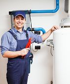 picture of construction worker  - Portrait of a smiling plumber at work - JPG 