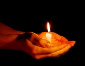 image of religion  - candle in a hand - JPG 