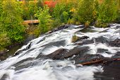 foto of bond  - Autumn foliage surrounds the cascading waters of Bond Falls in northern Michigan - JPG 