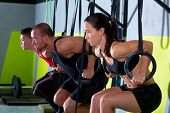 stock photo of group  - dip ring group workout at gym dipping in a row exercise - JPG 