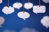 foto of cord  - Blank white speech bubbles hanging from a cord - JPG 