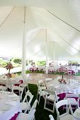 picture of wedding  - Inside a large wedding tent set up for an outdoor reception - JPG 