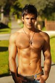 foto of fitness  - A young topless fit man standing outside - JPG 