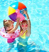 image of outdoor  - Child playing in swimming pool - JPG 