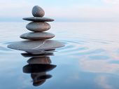 3d rendering of Zen stones in water with reflection - peace balance meditation relaxation concept