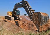 image of construction  - Excavator on construction site with big shovel.
** Note: Slight blurriness, best at smaller sizes - JPG 