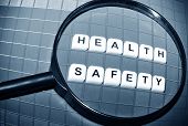 stock photo of health  - Focus on health and safety concept with magnifying glass and key words - JPG 