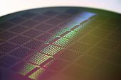 picture of silicon  - Silicon wafer up close reflecting spectrum of colors
 - JPG 