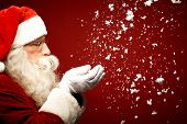 foto of  photo  - Photo of Santa Claus blowing snow and looking at it - JPG 
