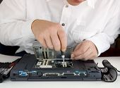 pic of computer  - a computer expert repaired a brocken notebook - JPG 