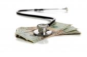 picture of health  - A stethoscope and American money on a white background  - JPG 