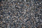 picture of embed  - many colorful pebble embed on wall background texture - JPG 