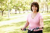 pic of woman  - Senior Hispanic woman with bike - JPG 