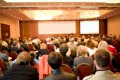 picture of meeting  - Rear view of many listeners sitting on chairs during lecture at conference - JPG 