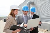 stock photo of industrial  - Business people meeting on industrial site - JPG 