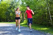 image of fitness  - Young couple jogging in park - JPG 