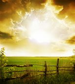 stock photo of sunset  - sunset on field at summer - JPG 