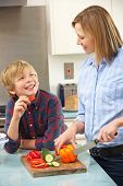 picture of food  - Mother and son preparing food in domestic kitchen - JPG 