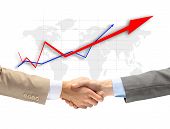 pic of handshake  - Handshake with map of the world in background - JPG 