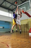 stock photo of competition  - competition cencept with people who playing basketball in school gym - JPG 