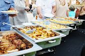 pic of food  - people choosing food from table on catering and buffet party on business seminar conference or wedding - JPG 