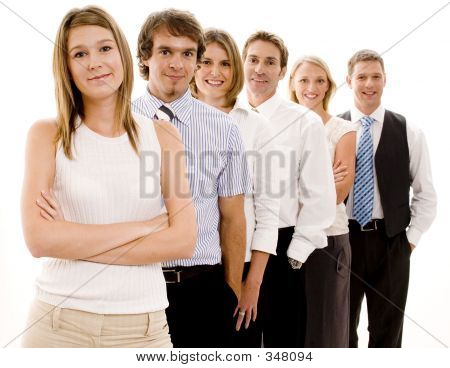 Picture or Photo of A smiling group of business people in a line (shallow depth of field used)