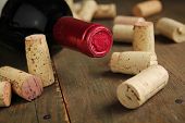 pic of restaurant  - Cork wine on a wooden table with a bottle of red wine - JPG 
