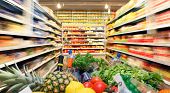 stock photo of food  - Full shopping cart with fruit vegetable food in supermarket - JPG 