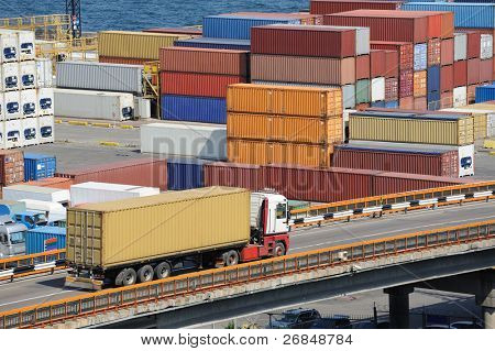 Picture or Photo of Truck transports container to a warehouse near the sea