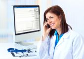 foto of medical doctors  - Smiling medical doctor woman with computer and telephone - JPG 