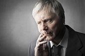 pic of watch  - Senior businessman with worried expression - JPG 