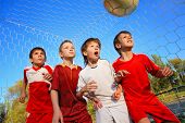 picture of sports  - Little Boys playing soccer on the sports field next to goal - JPG 