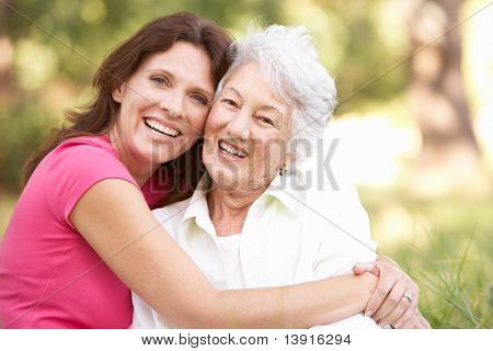 Picture or Photo of Senior Woman With Adult Daughter In Park