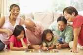 foto of game  - Extended Family Group Playing Board Game At Home - JPG 